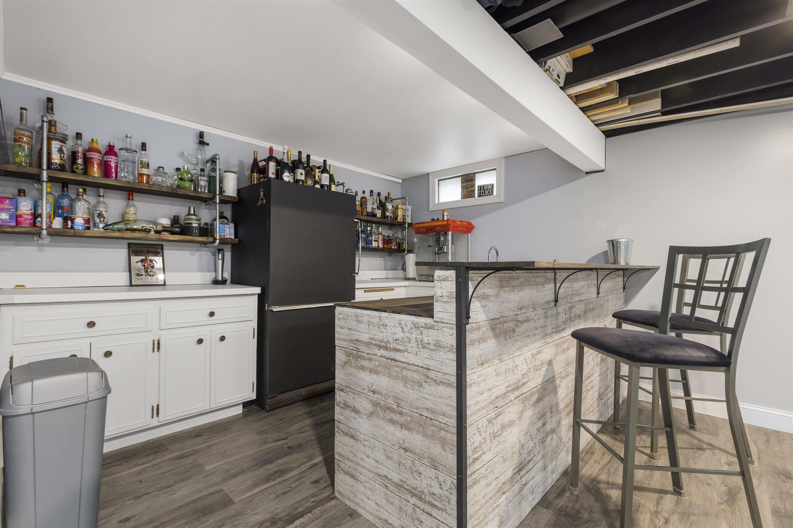 4711 Brookview Road Rockford, IL 61107 - Photo 17 of 26 a kitchen with cabinets and wooden floor