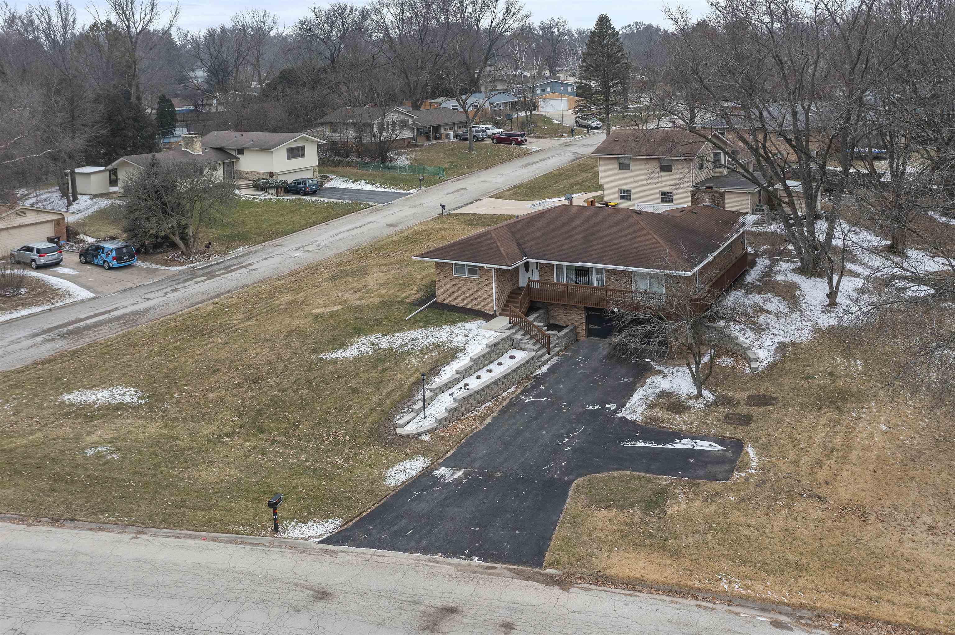 4711 Brookview Road Rockford, IL 61107 - Photo 19 of 26 a view of a house with a yard and sitting area