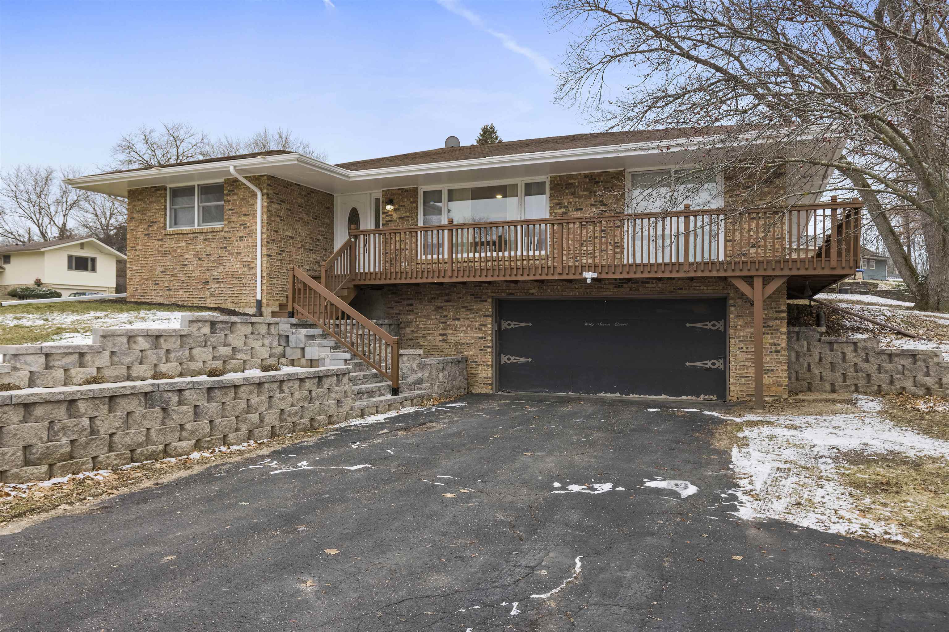 4711 Brookview Road Rockford, IL 61107 - Photo 2 of 26 a front view of a house with a garage