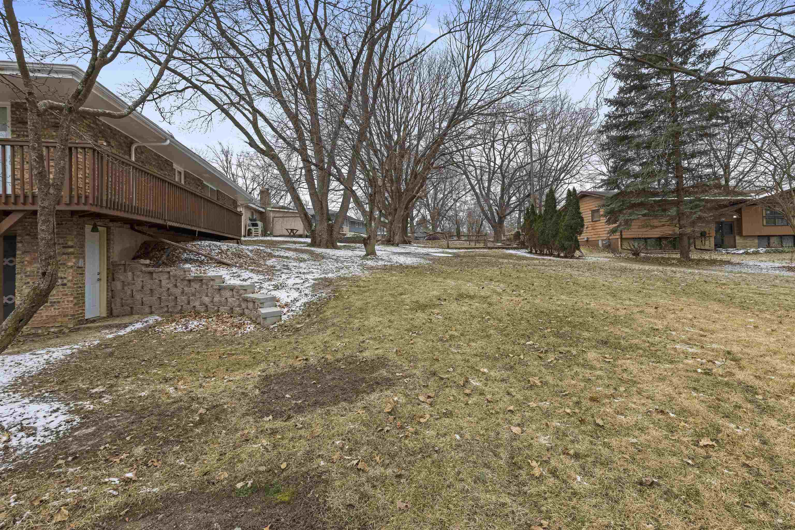 4711 Brookview Road Rockford, IL 61107 - Photo 3 of 26 a view of a yard with a house and a large tree