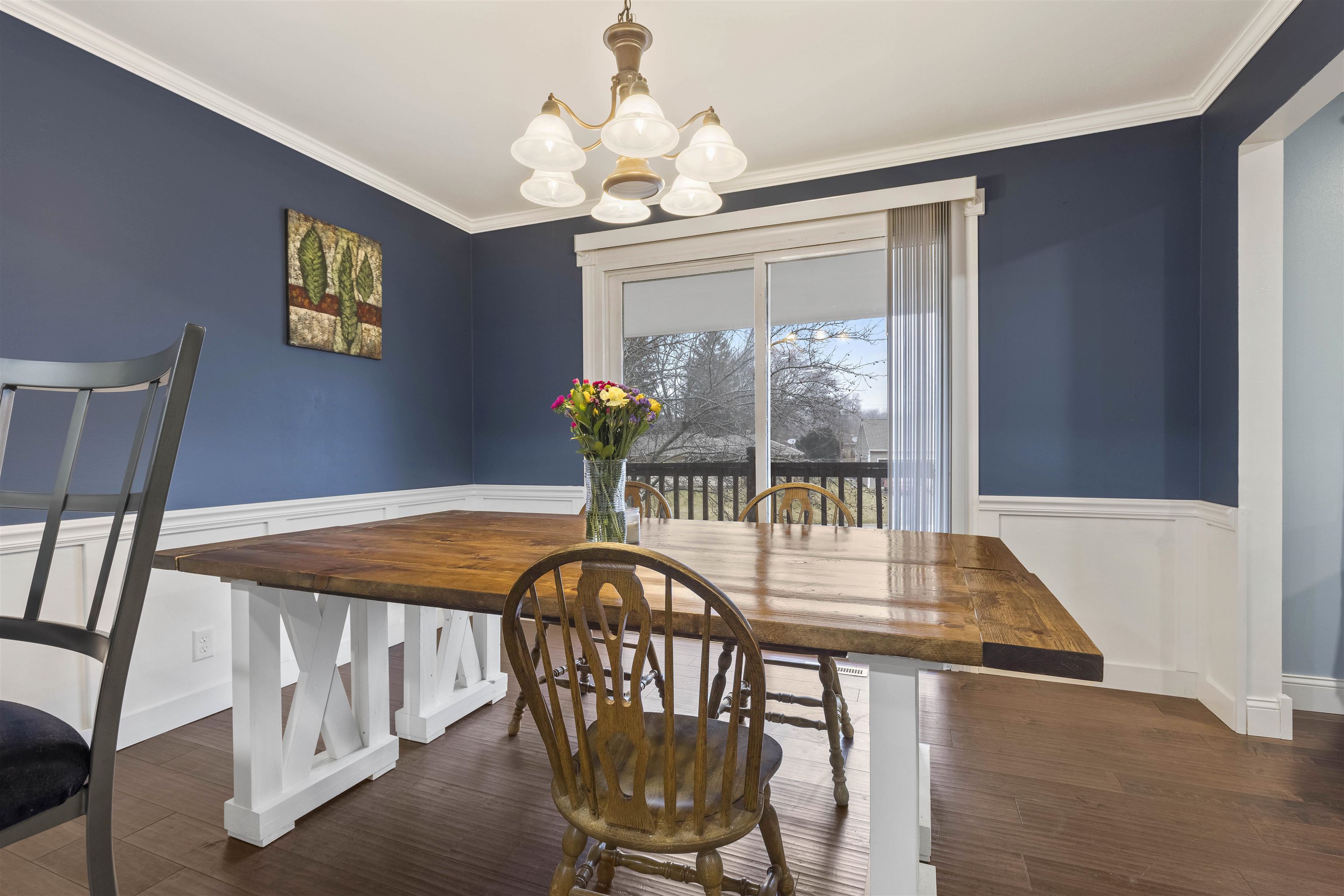 4711 Brookview Road Rockford, IL 61107 - Photo 6 of 26 a dining room with furniture a chandelier and wooden floor