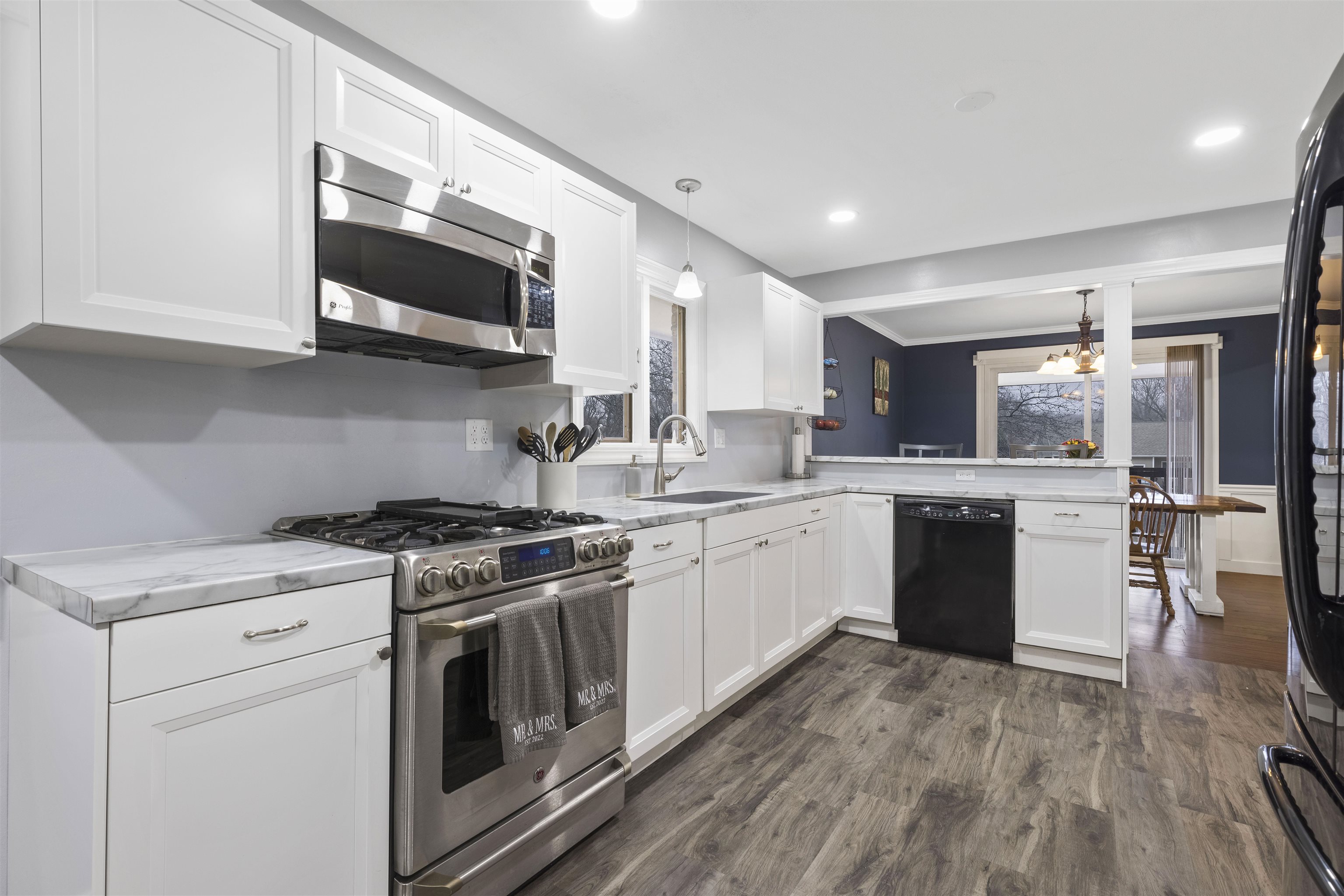 4711 Brookview Road Rockford, IL 61107 - Photo 8 of 26 a kitchen with stainless steel appliances granite countertop a sink a stove top oven a counter space and cabinets