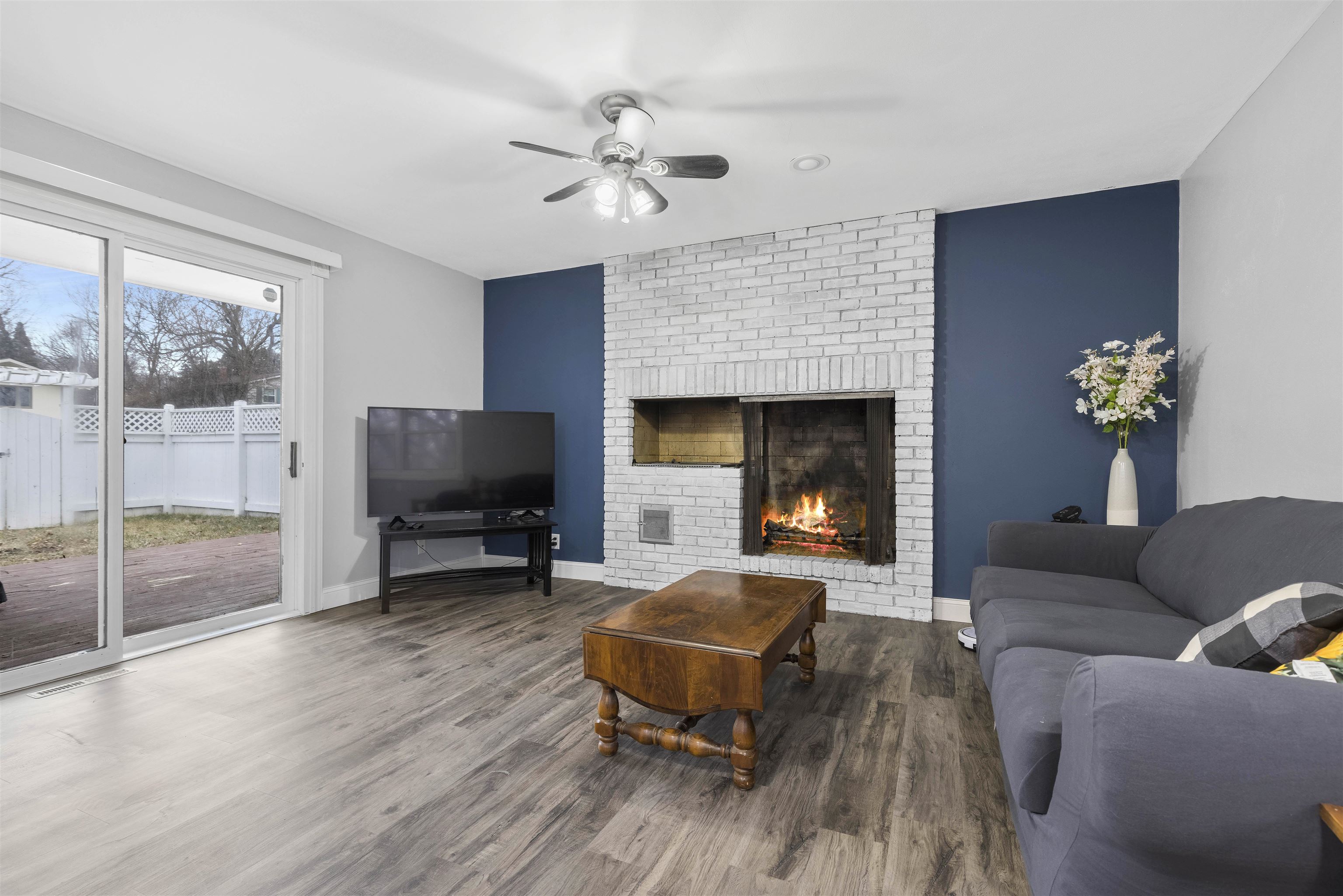 4711 Brookview Road Rockford, IL 61107 - Photo 9 of 26 a living room with furniture and a fireplace