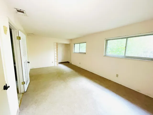 a view of a room with windows