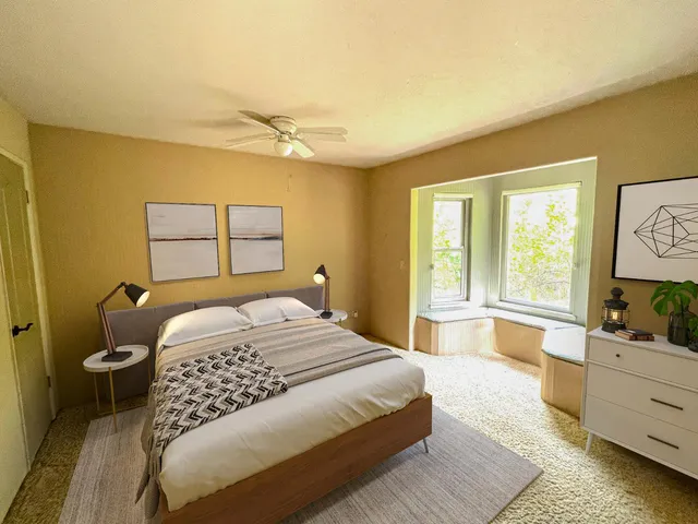 a bedroom with a bed and window