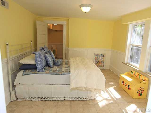 706 North East Street Raleigh, NC 27604 - Photo 12 of 14 Large lower-level bedroom suite with separate entrance and two closets. New ceramic tile on floor. Opens to private, full bath. Bedroom
