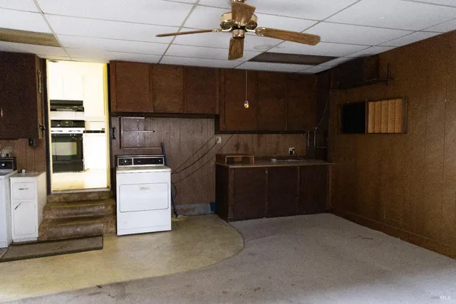 a kitchen with refrigerator and window