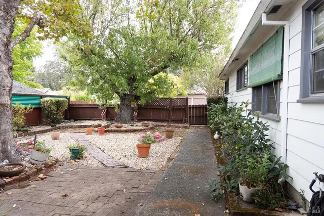 a view of a backyard with sitting area