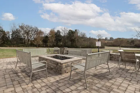 a view of a park with iron fence