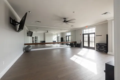 an aerial view of a house with a swimming pool