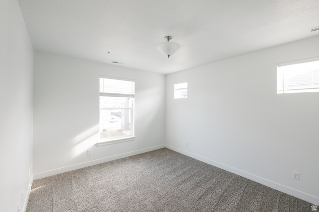 4653 South Alder Drive, Unit H304 Mapleton, UT 84664 - Photo 8 of 14 Spare room featuring carpet flooring and baseboards