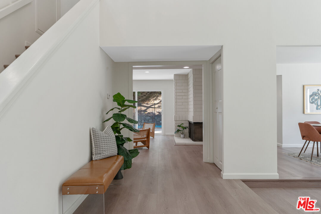 19 Rippling Streme Irvine, CA 92603 - Photo 11 of 69 a living room with furniture and a potted plant