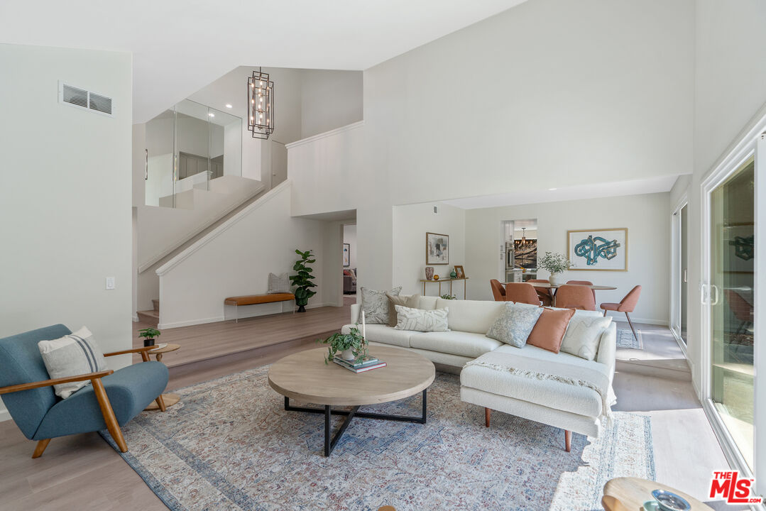 19 Rippling Streme Irvine, CA 92603 - Photo 12 of 69 a living room with furniture and a table