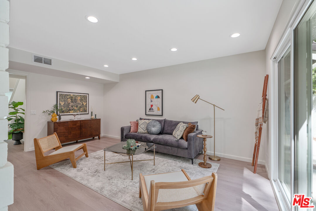 19 Rippling Streme Irvine, CA 92603 - Photo 16 of 69 a living room with furniture and a rug
