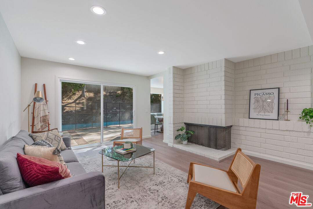 19 Rippling Streme Irvine, CA 92603 - Photo 17 of 69 a living room with furniture and a fireplace