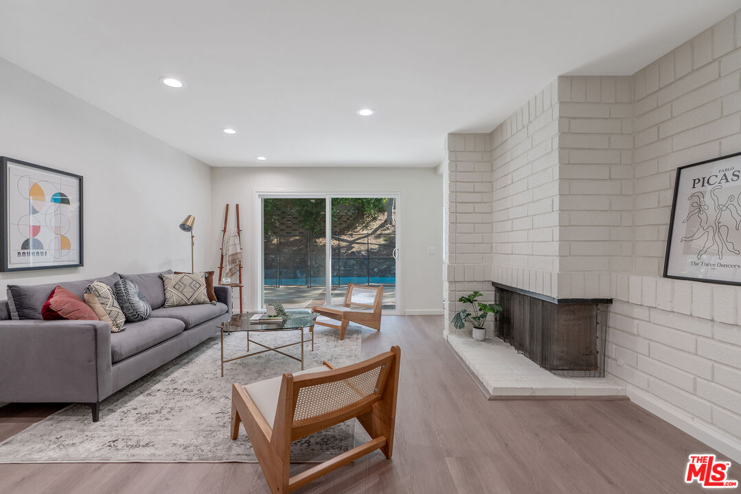19 Rippling Streme Irvine, CA 92603 - Photo 18 of 69 a living room with furniture and a fireplace
