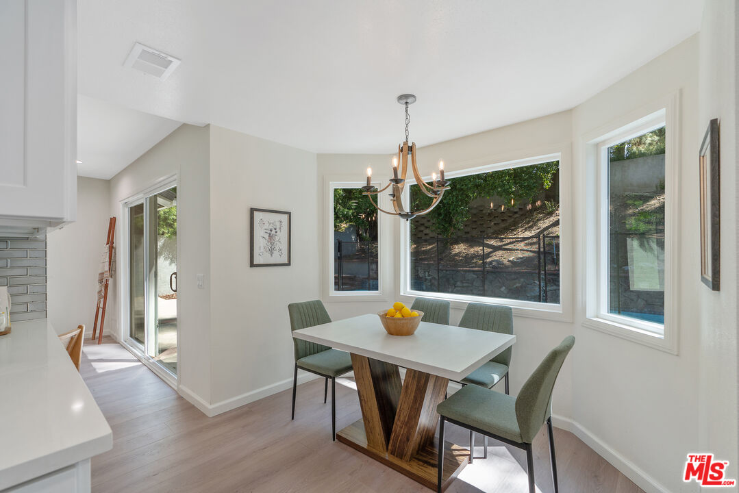 19 Rippling Streme Irvine, CA 92603 - Photo 26 of 69 a view of a dining room with a table and chairs