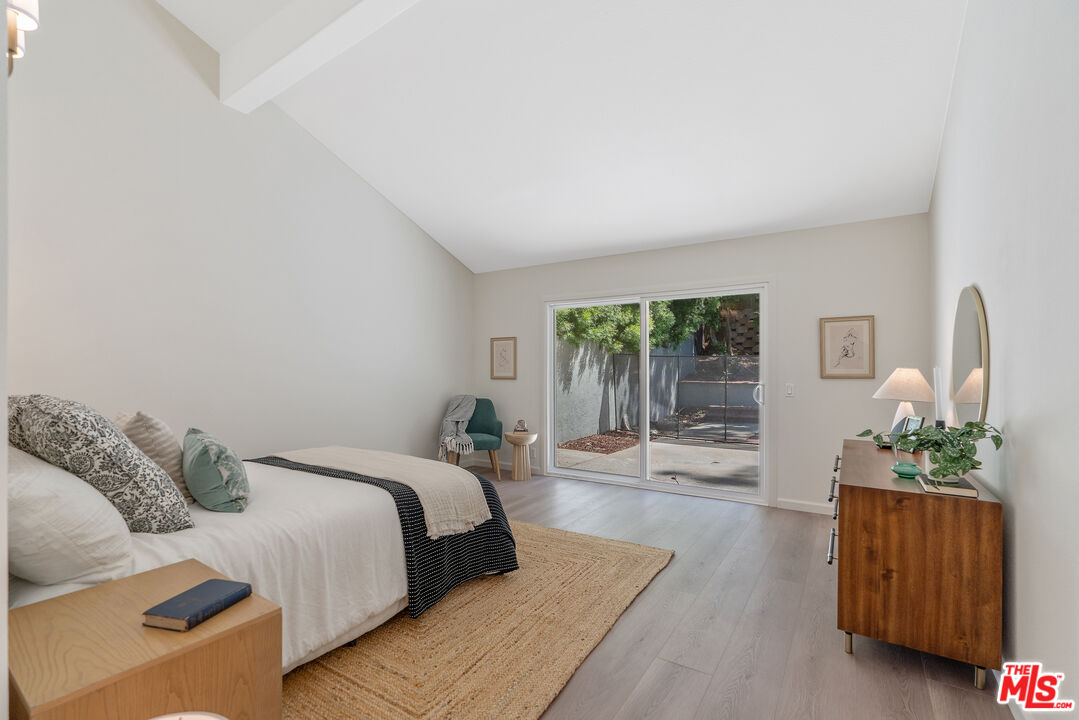 19 Rippling Streme Irvine, CA 92603 - Photo 30 of 69 a spacious bedroom with a bed a couch and dresser