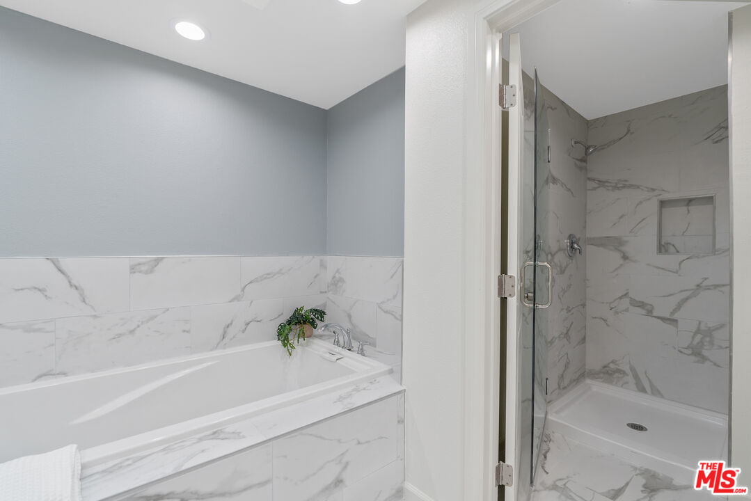 19 Rippling Streme Irvine, CA 92603 - Photo 36 of 69 a bathroom with a bathtub and shower