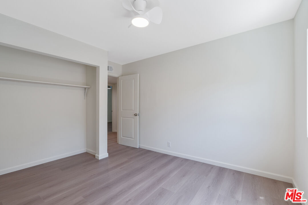 19 Rippling Streme Irvine, CA 92603 - Photo 42 of 69 a view of an empty room with wooden floor