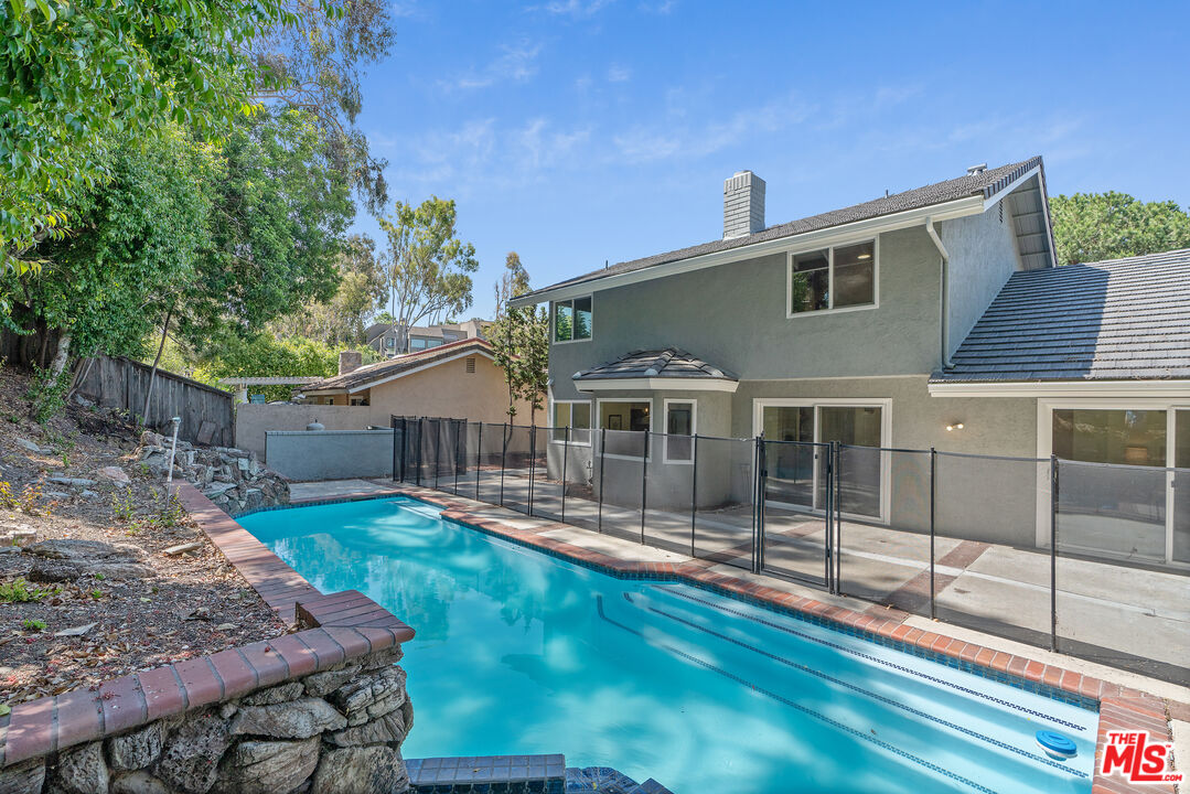 19 Rippling Streme Irvine, CA 92603 - Photo 54 of 69 a front view of a house with a yard