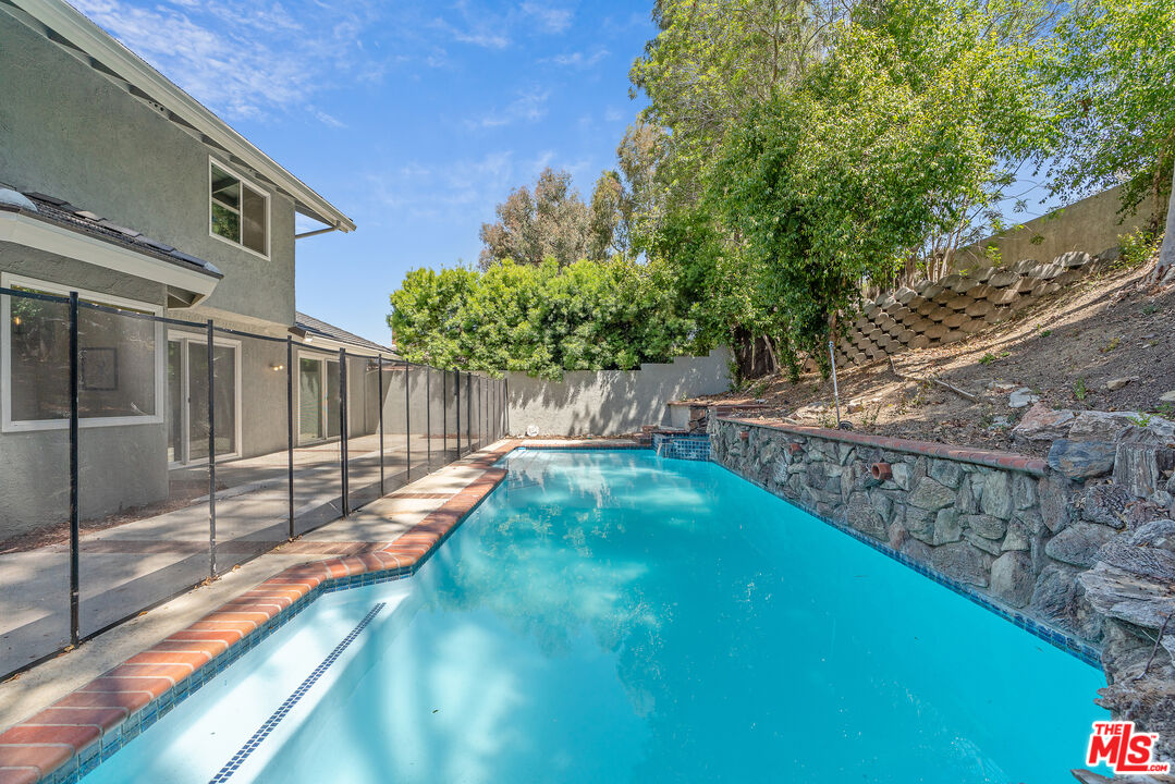 19 Rippling Streme Irvine, CA 92603 - Photo 57 of 69 a view of a backyard with a small cabin