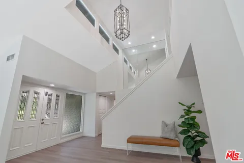 a living room with furniture and a lamp