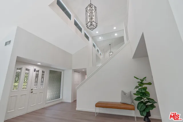 a living room with furniture and a lamp