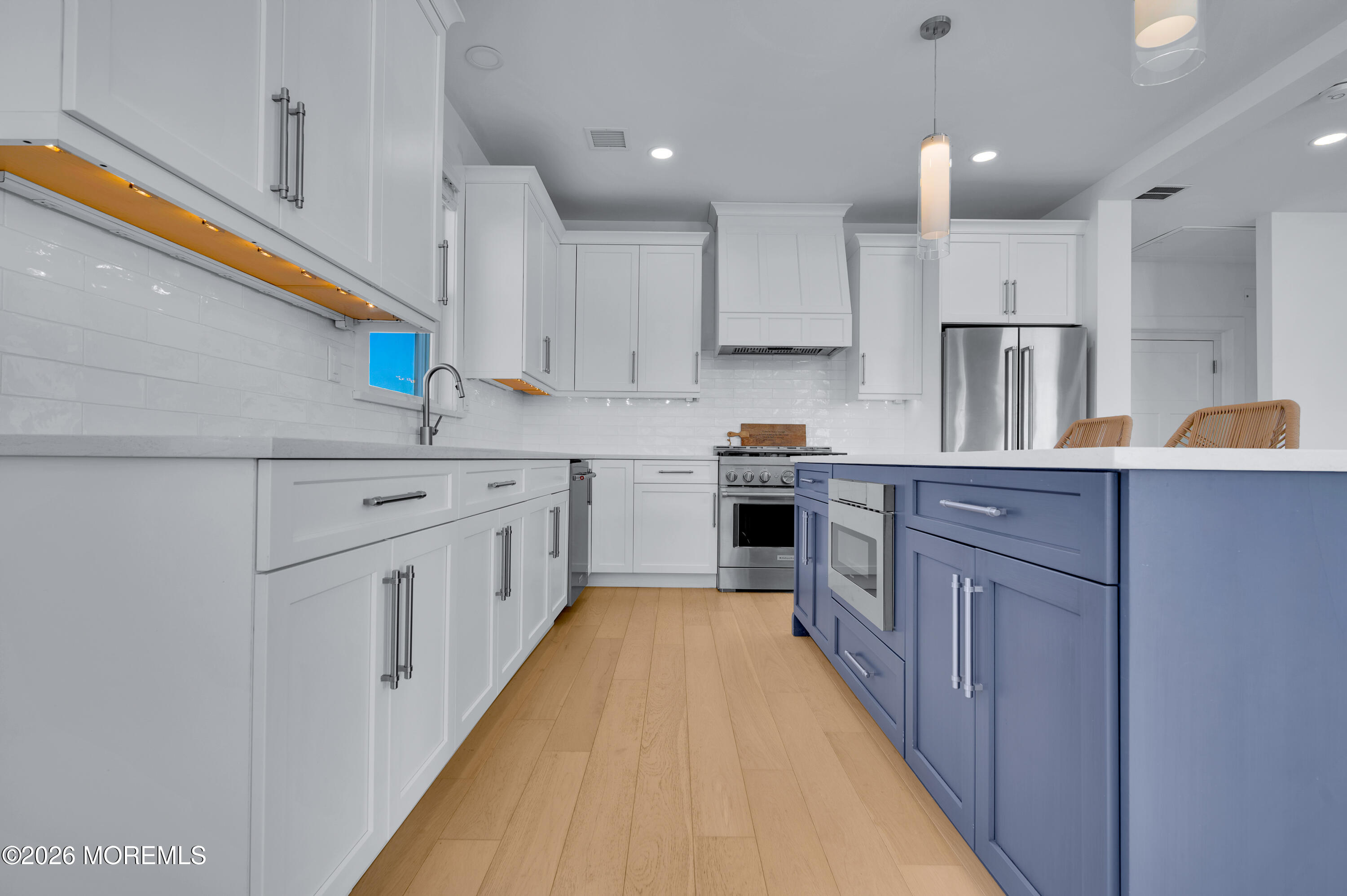 2000 Highway 35 Seaside Heights, NJ 08751 - Photo 10 of 55 a kitchen with kitchen island cabinets a sink a counter top space stainless steel appliances and cabinets