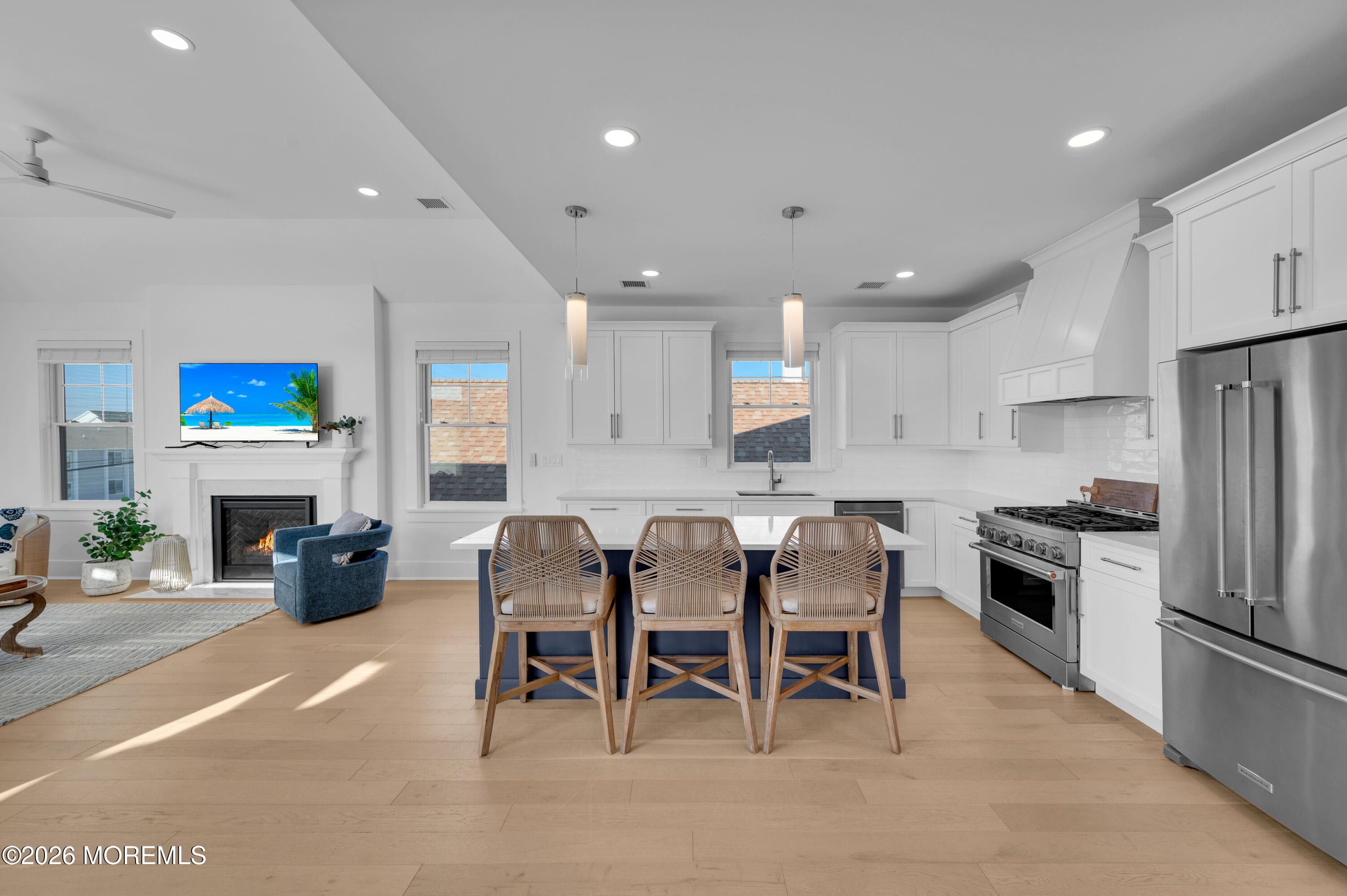 2000 Highway 35 Seaside Heights, NJ 08751 - Photo 12 of 55 a kitchen with stainless steel appliances kitchen island granite countertop a table and chairs in it