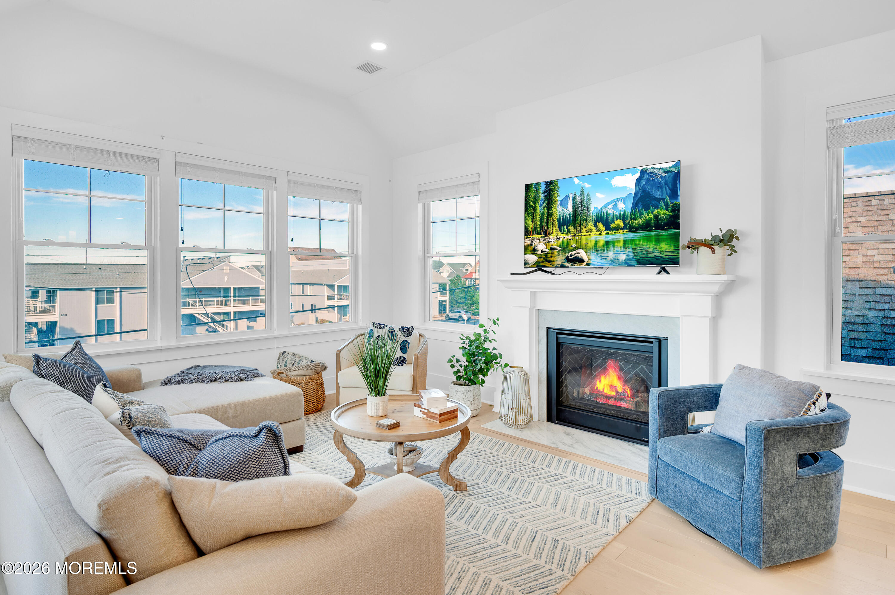 2000 Highway 35 Seaside Heights, NJ 08751 - Photo 15 of 55 a living room with furniture a flat screen tv and a fireplace