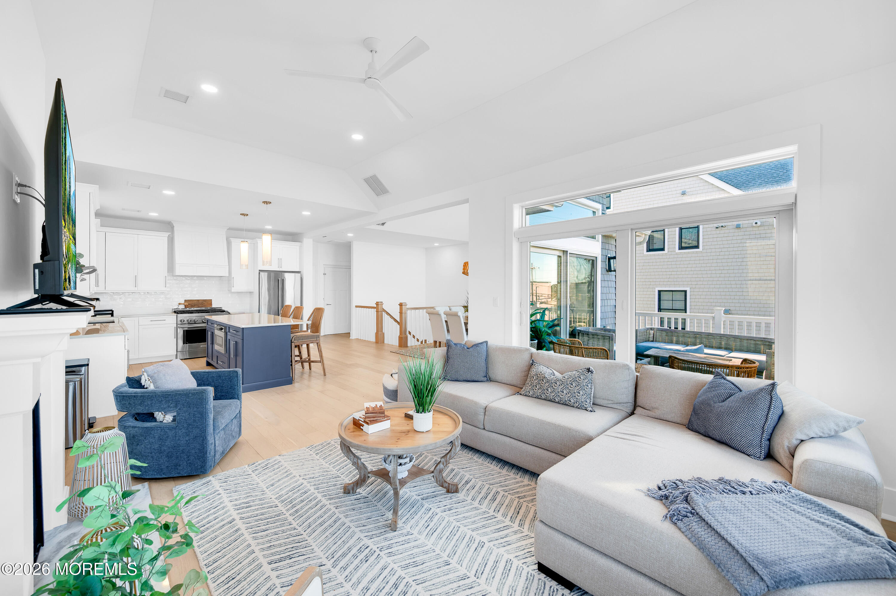 2000 Highway 35 Seaside Heights, NJ 08751 - Photo 16 of 55 a living room with furniture kitchen view and a chandelier