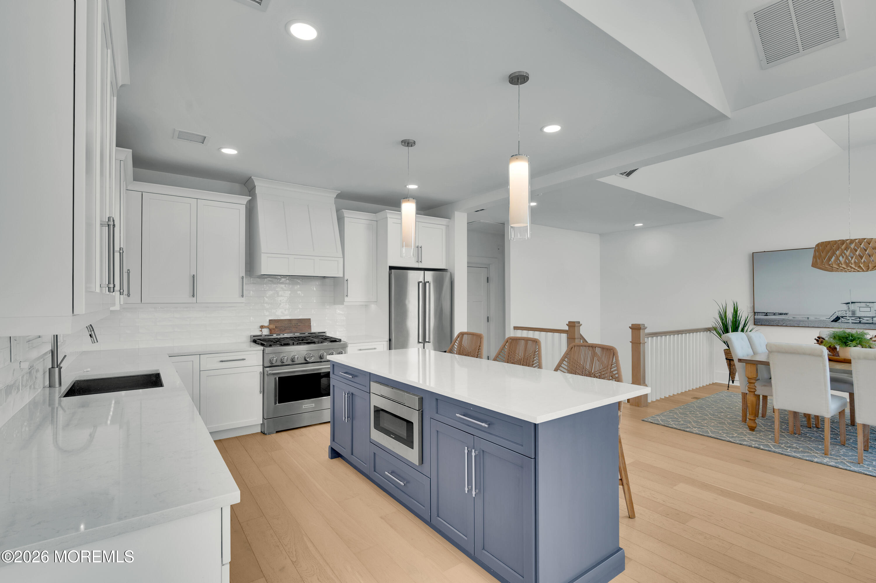 2000 Highway 35 Seaside Heights, NJ 08751 - Photo 3 of 55 a large kitchen with stainless steel appliances and a view of living room