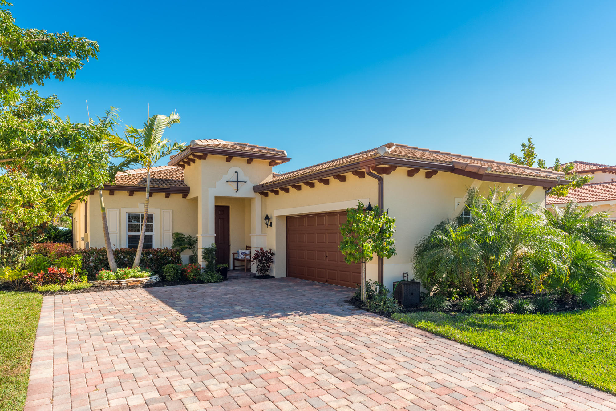 151 Rudder Cay Way Jupiter, FL 33458 - Photo 1 of 32 a front view of a house with garden