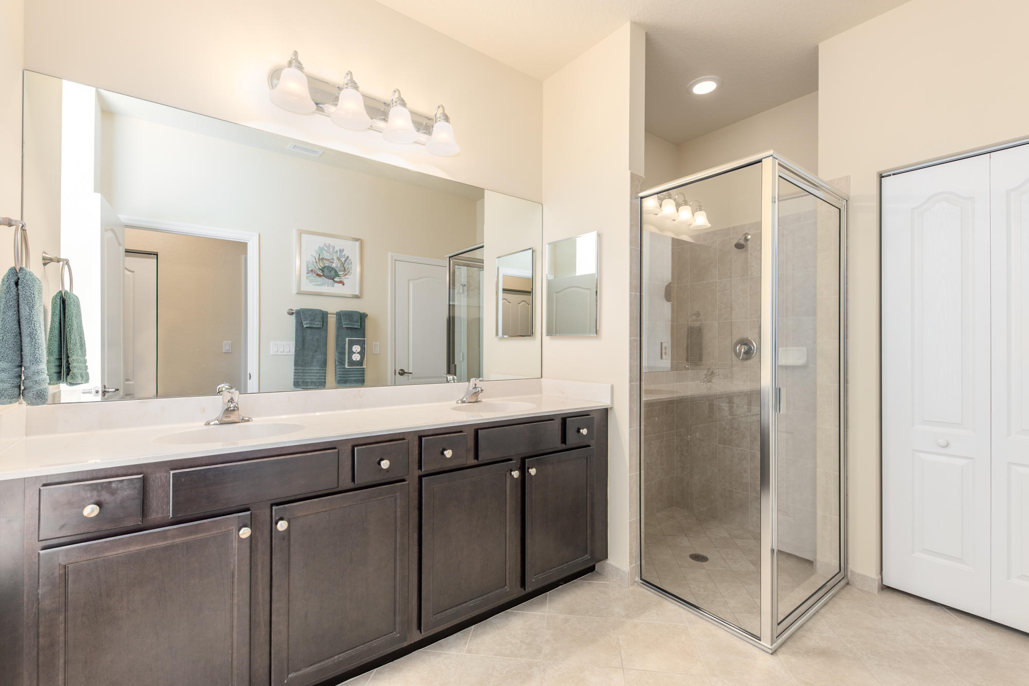 151 Rudder Cay Way Jupiter, FL 33458 - Photo 15 of 32 a spacious bathroom with a shower sink and mirror