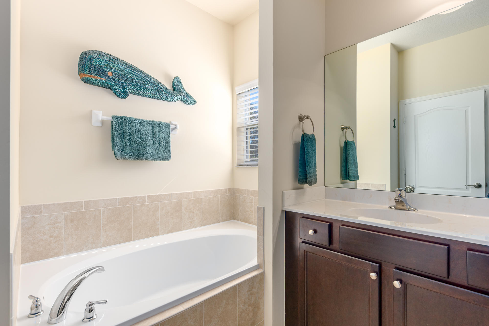 151 Rudder Cay Way Jupiter, FL 33458 - Photo 16 of 32 a bathroom with a bathtub and a sink