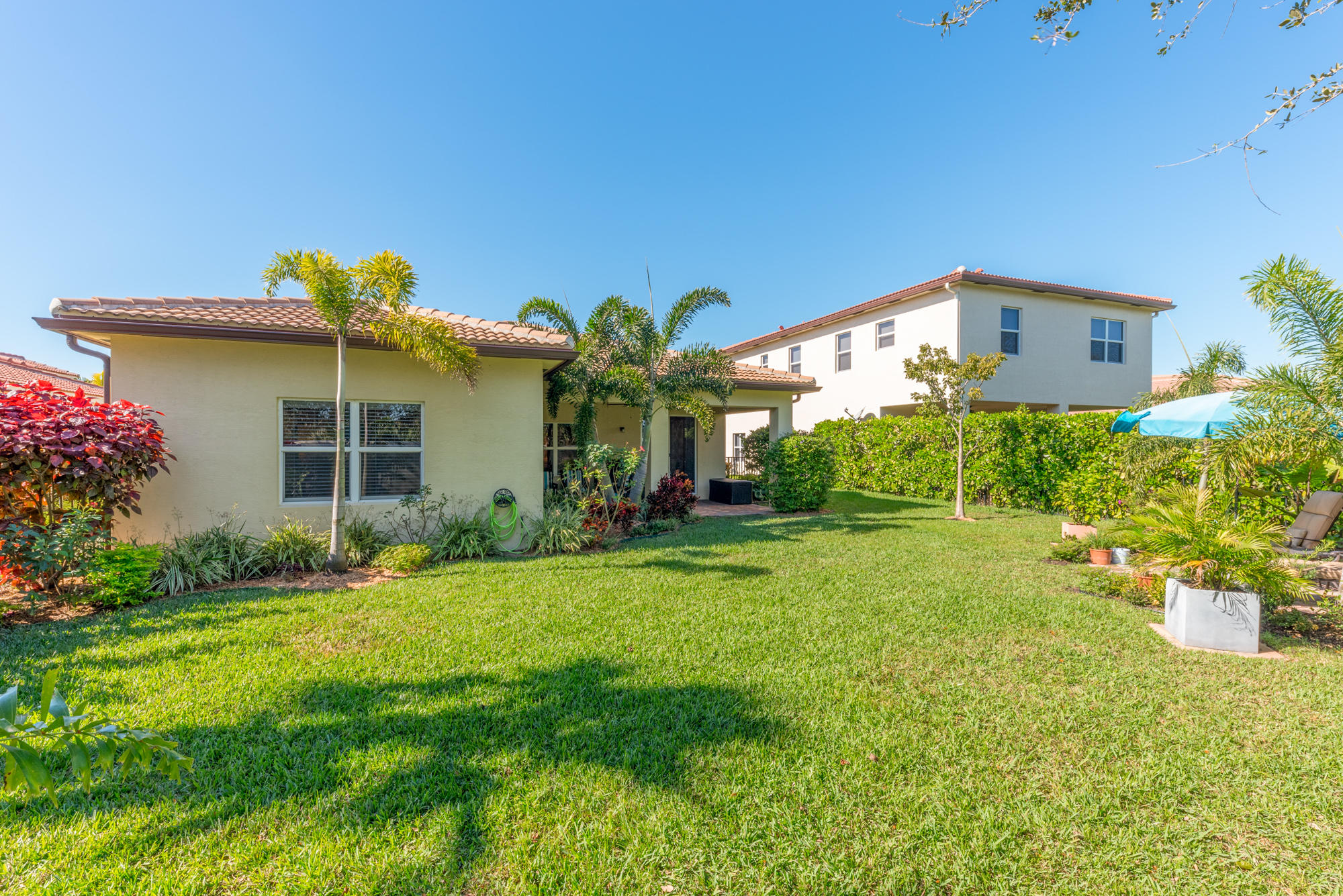 151 Rudder Cay Way Jupiter, FL 33458 - Photo 23 of 32 a front view of a house with garden