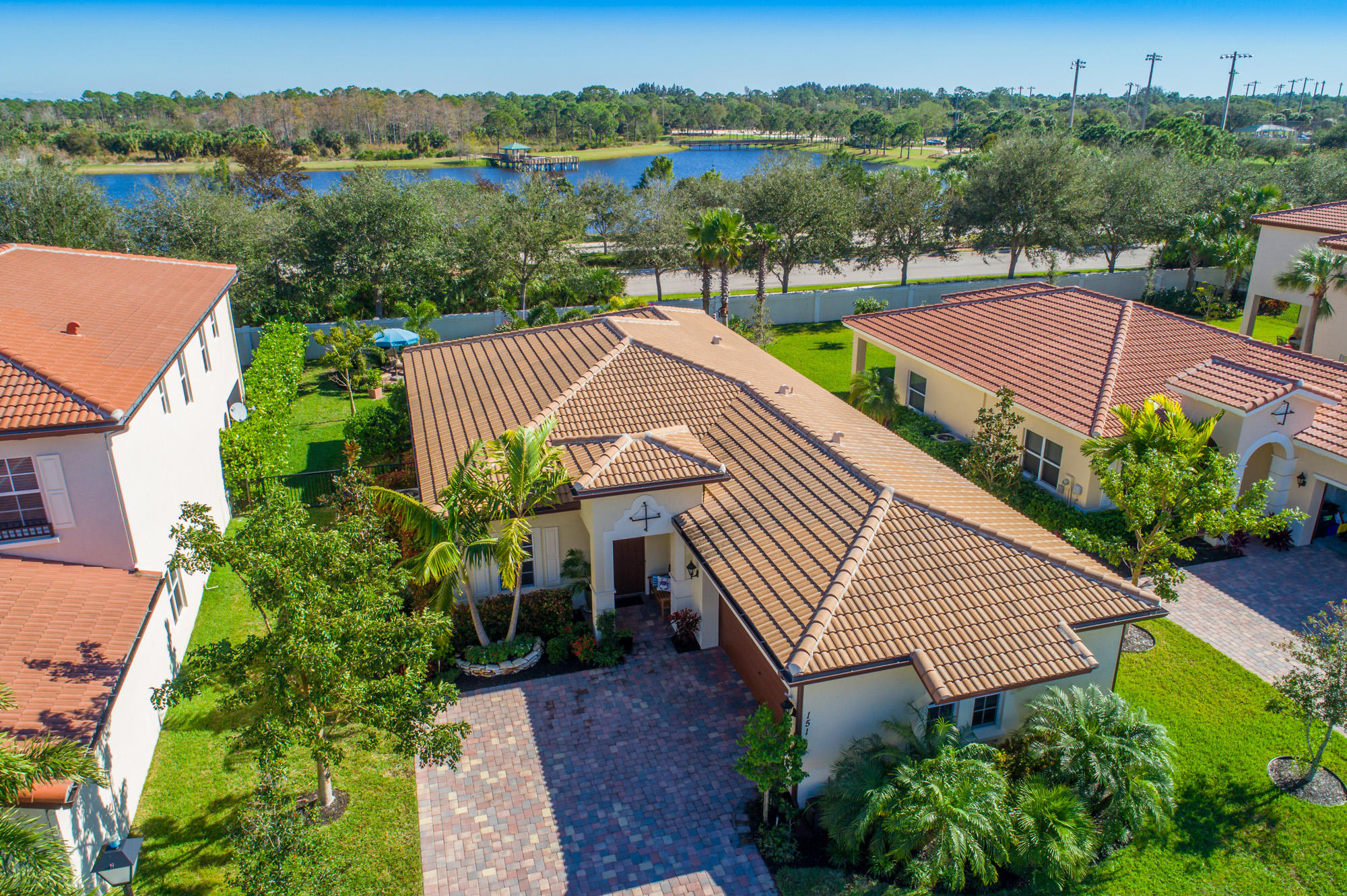 151 Rudder Cay Way Jupiter, FL 33458 - Photo 26 of 32 an aerial view of a house with pool and garden