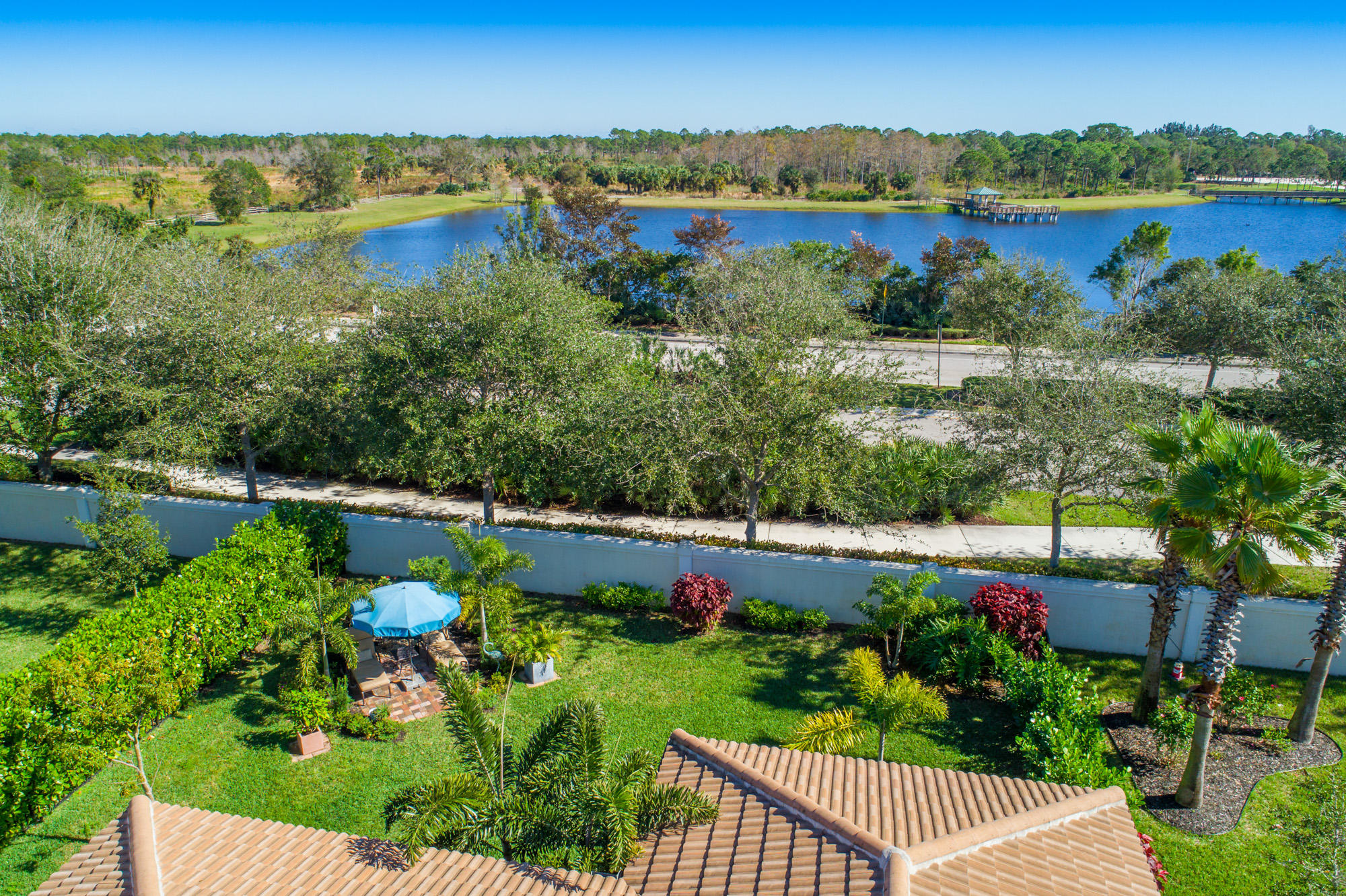 151 Rudder Cay Way Jupiter, FL 33458 - Photo 27 of 32 a view of lake with houses in the background