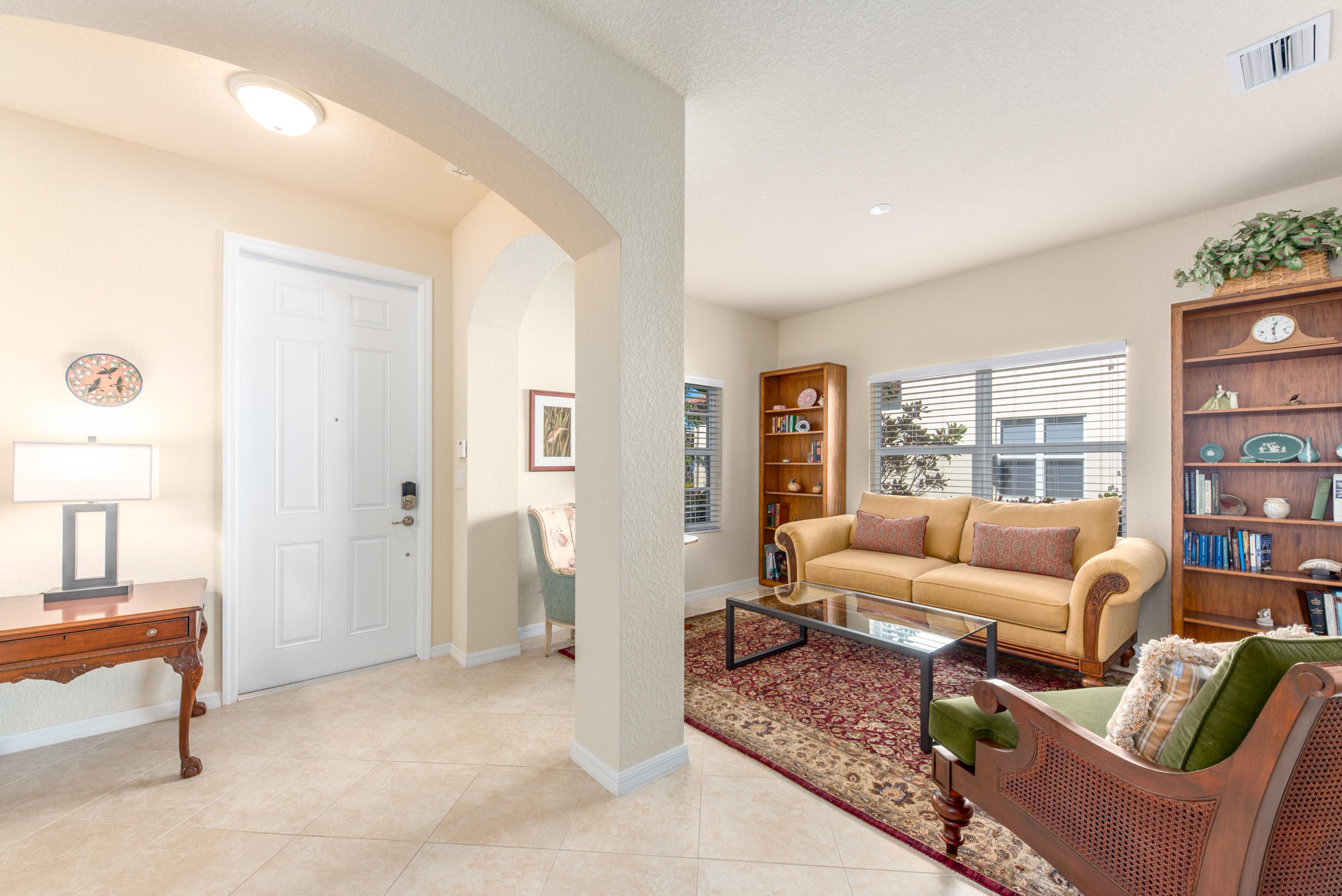 151 Rudder Cay Way Jupiter, FL 33458 - Photo 3 of 32 a living room with furniture and a large window