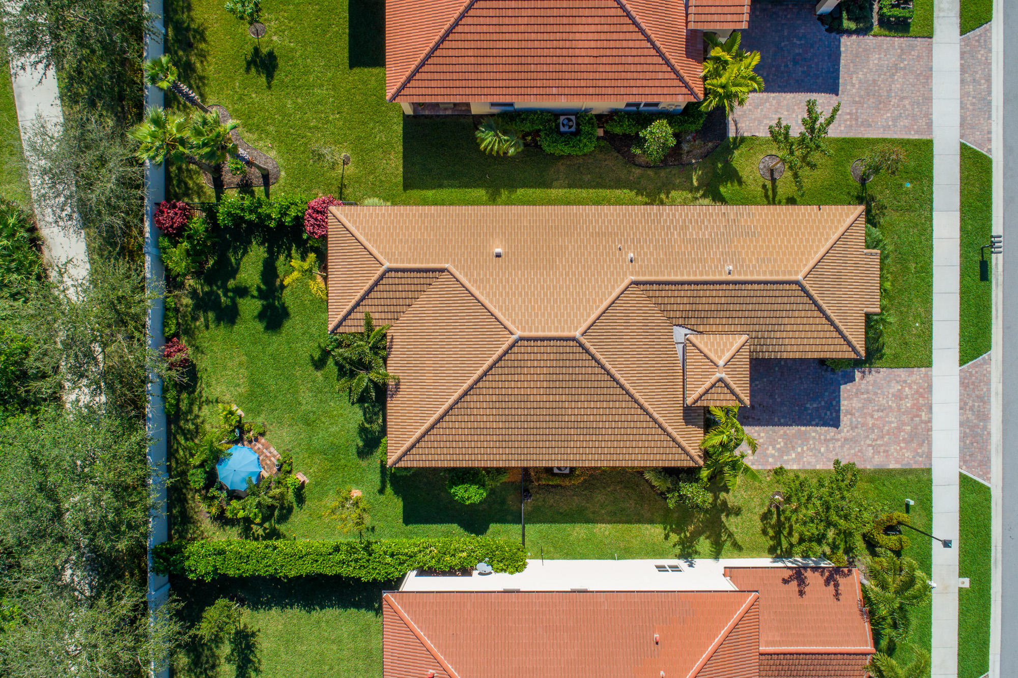 151 Rudder Cay Way Jupiter, FL 33458 - Photo 32 of 32 an aerial view of a house with a yard and potted plants