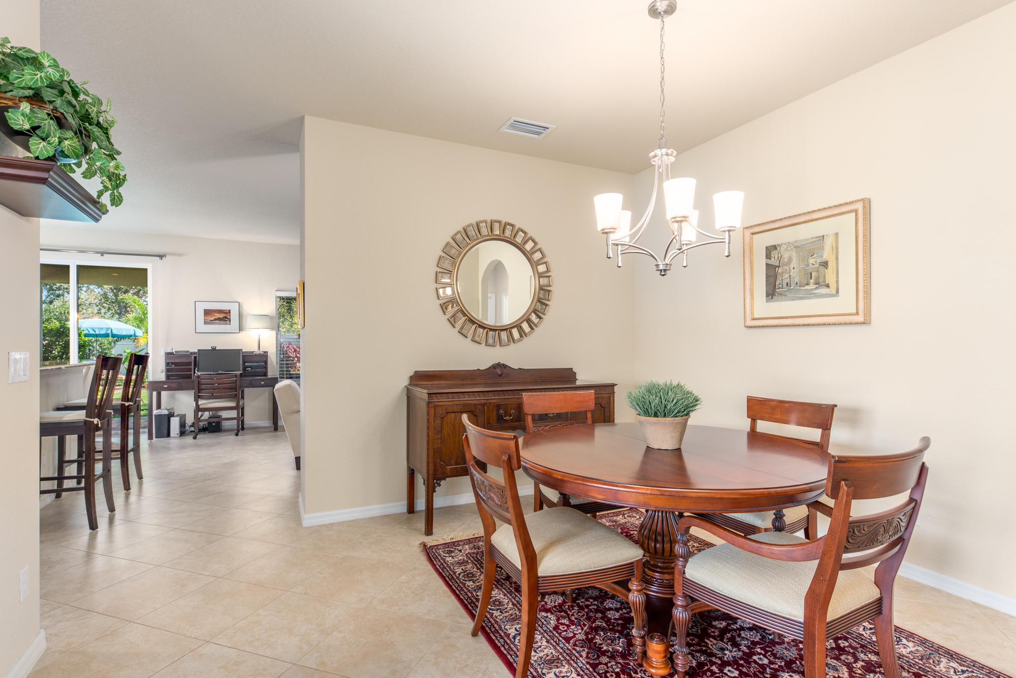 151 Rudder Cay Way Jupiter, FL 33458 - Photo 5 of 32 a view of a dining room with furniture and chandelier