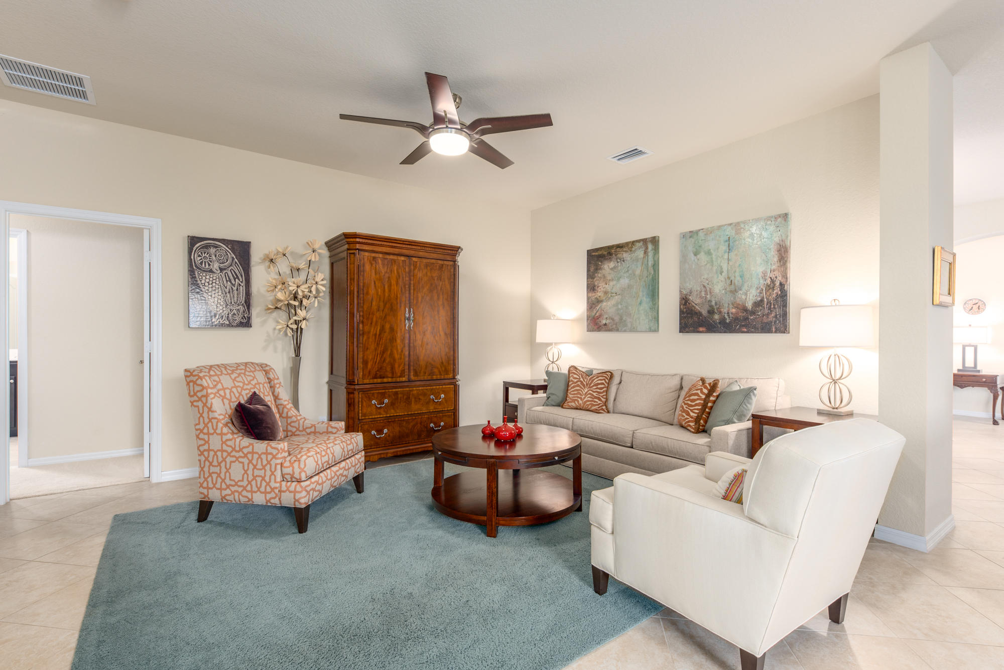 151 Rudder Cay Way Jupiter, FL 33458 - Photo 7 of 32 a living room with furniture and a lamp
