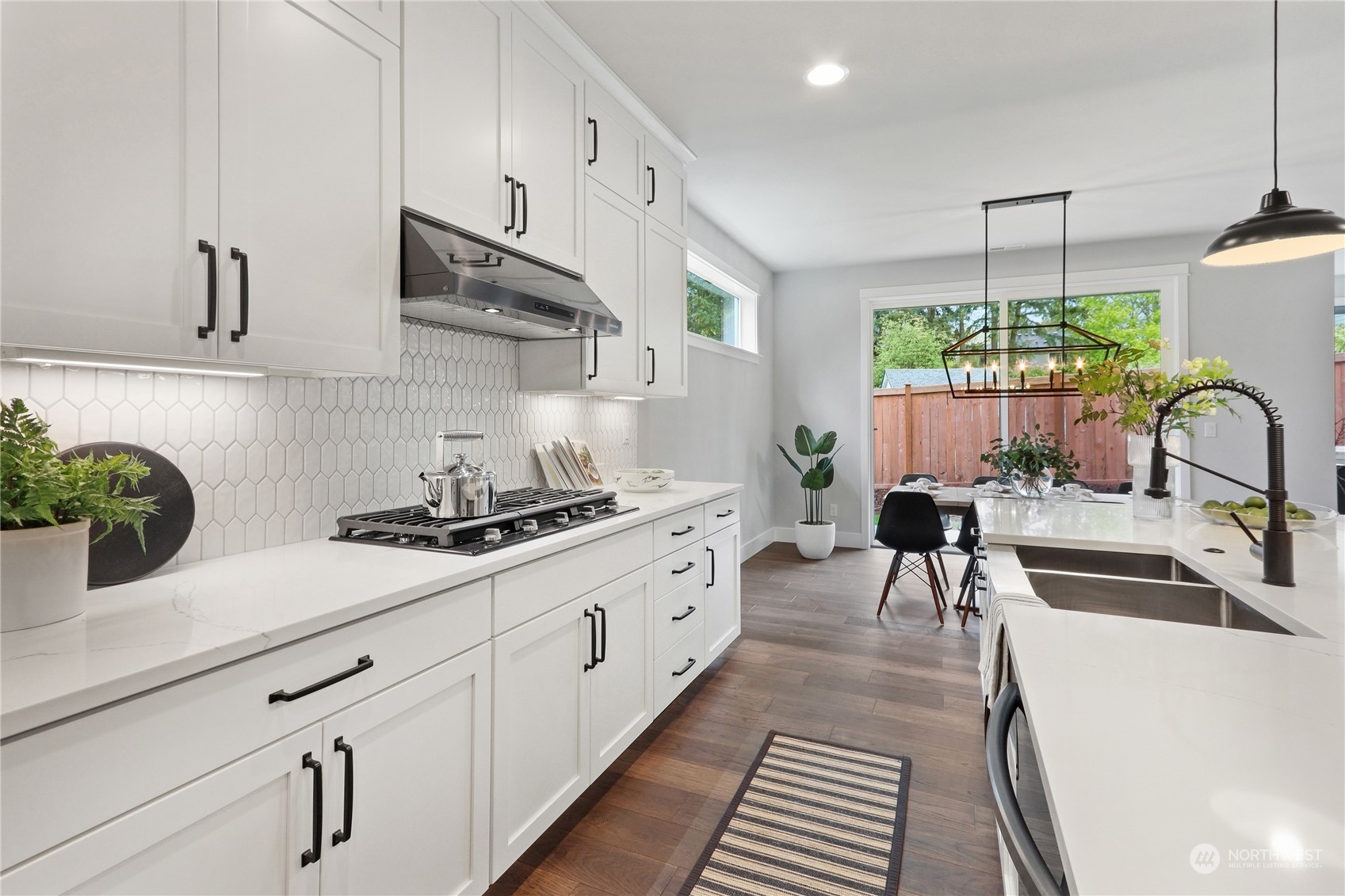 3915 211th Place Southeast Bothell, WA 98021 - Photo 12 of 24 a kitchen with stainless steel appliances a sink a stove and cabinets