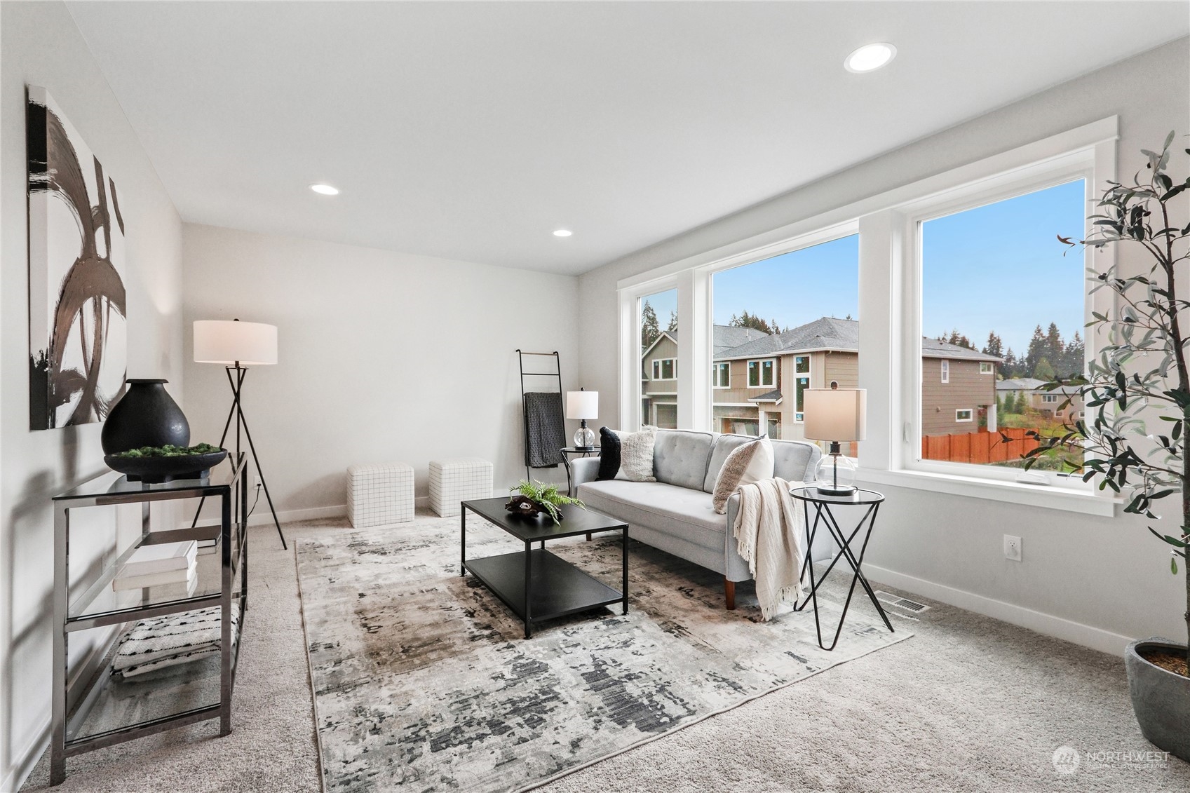 3915 211th Place Southeast Bothell, WA 98021 - Photo 15 of 24 a living room with furniture and a large window