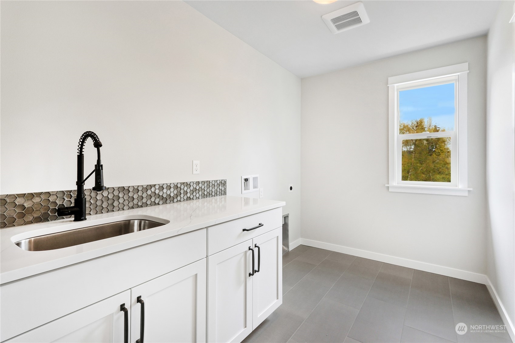 3915 211th Place Southeast Bothell, WA 98021 - Photo 24 of 24 a kitchen with a sink and cabinets