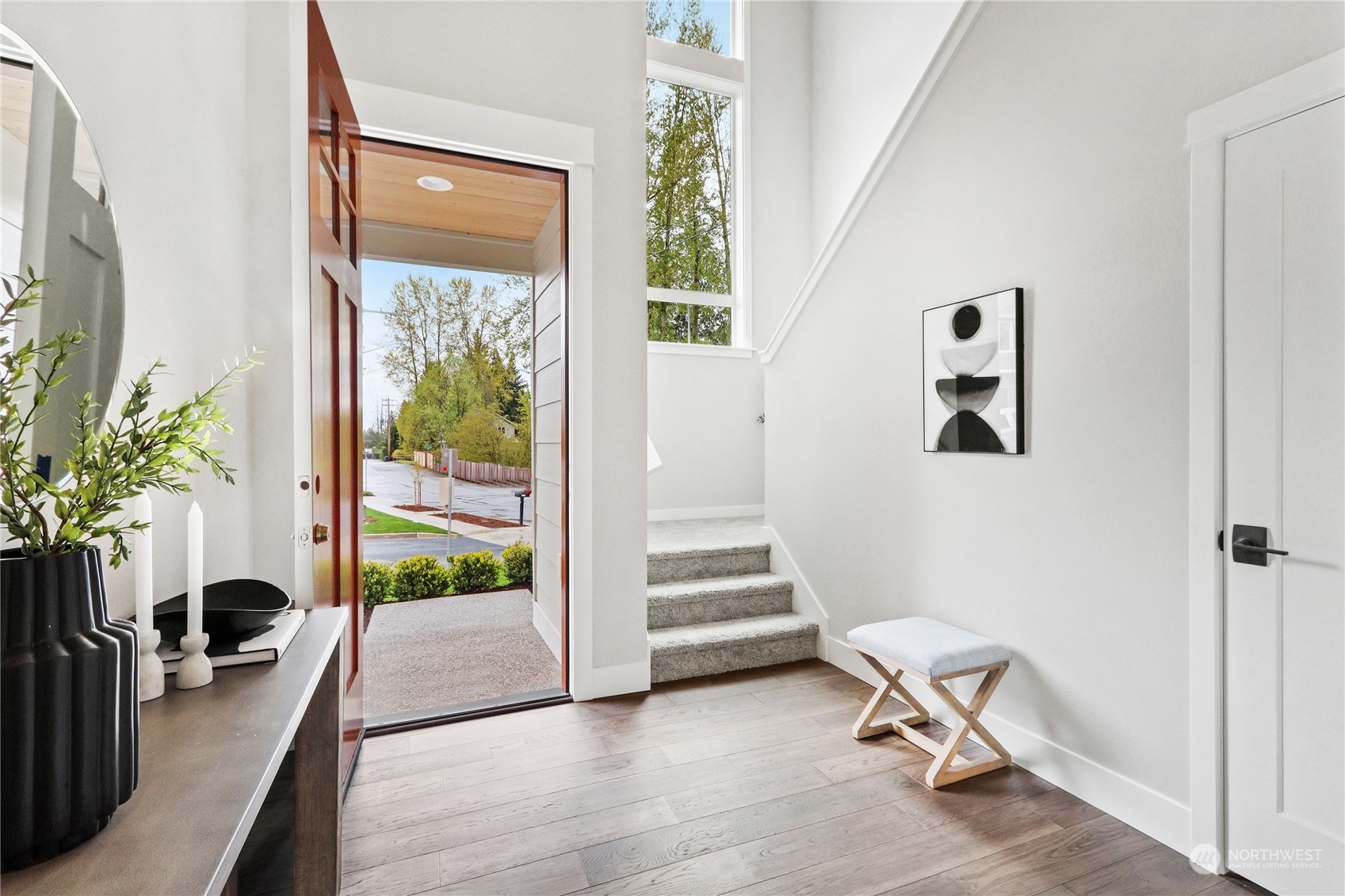 3915 211th Place Southeast Bothell, WA 98021 - Photo 3 of 24 a view of a room with wooden floor and windows