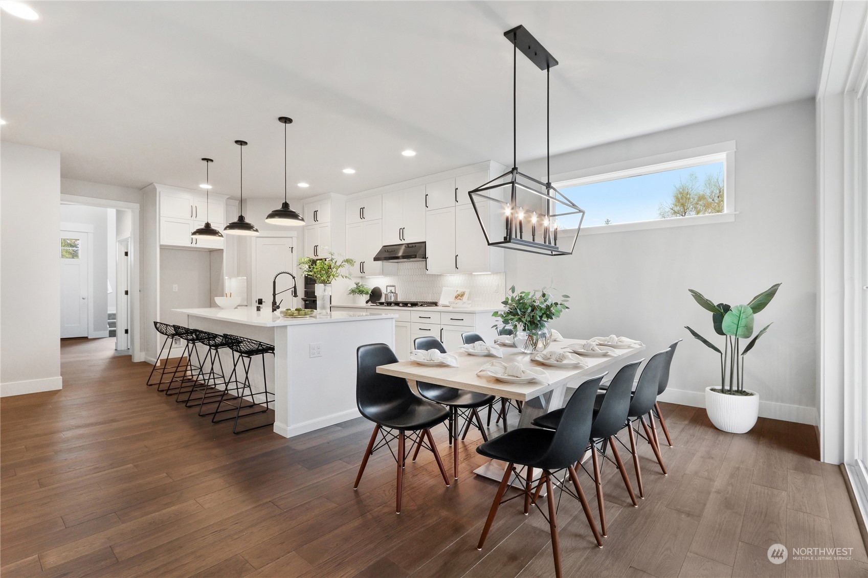 3915 211th Place Southeast Bothell, WA 98021 - Photo 4 of 24 a view of a dining room with furniture wooden floor and chandelier