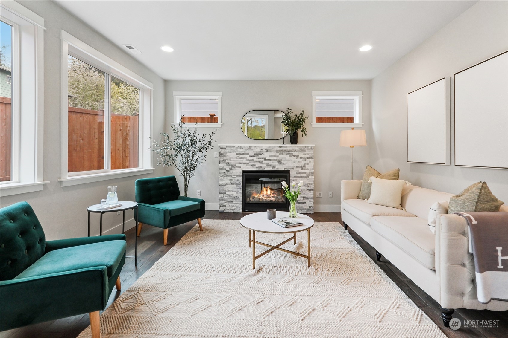 3915 211th Place Southeast Bothell, WA 98021 - Photo 7 of 24 a living room with furniture and a fireplace