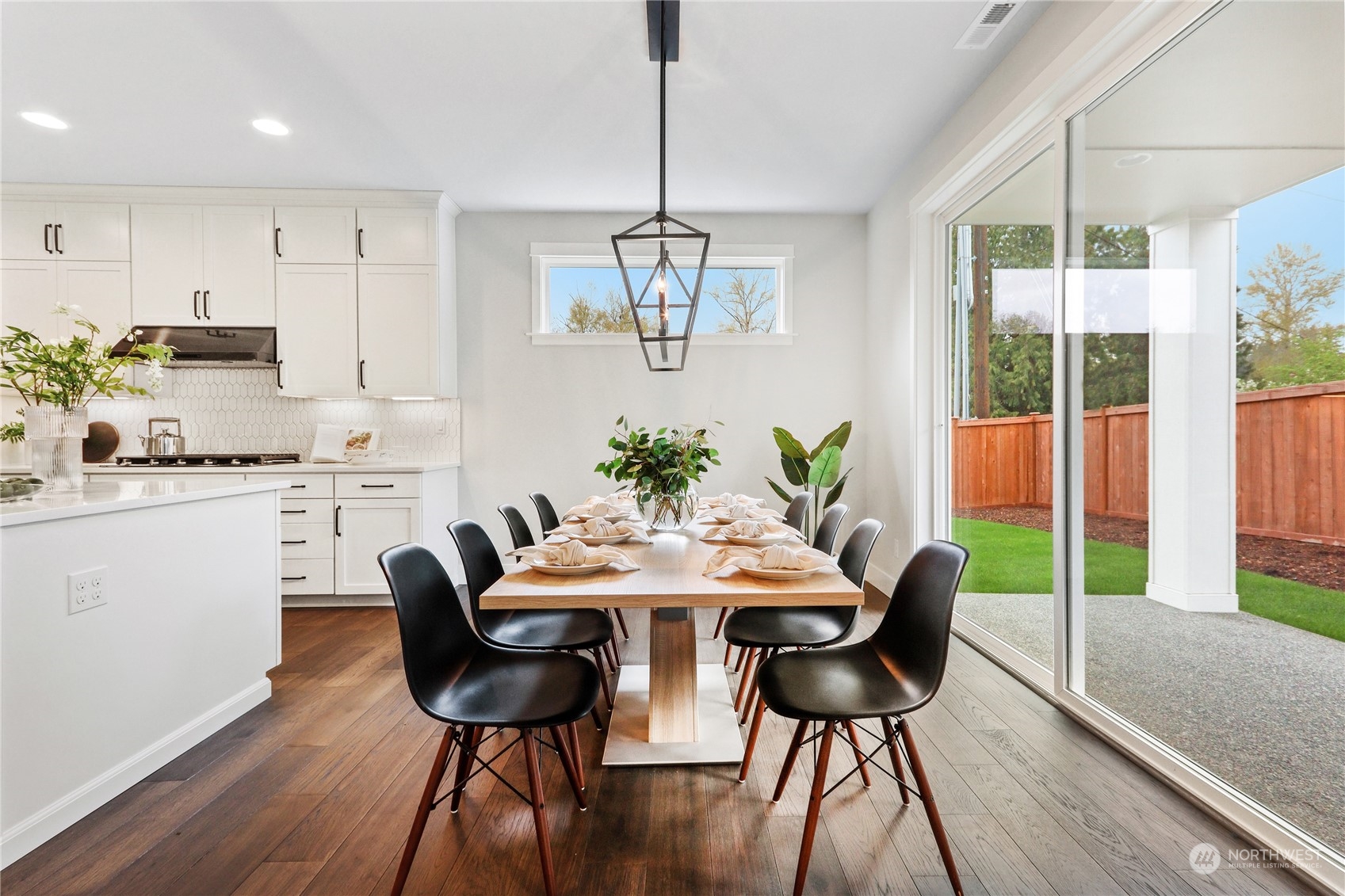 3915 211th Place Southeast Bothell, WA 98021 - Photo 8 of 24 a view of a dining room with furniture window and wooden floor